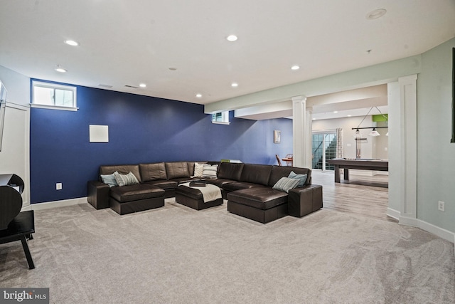 living room featuring carpet, baseboards, and recessed lighting