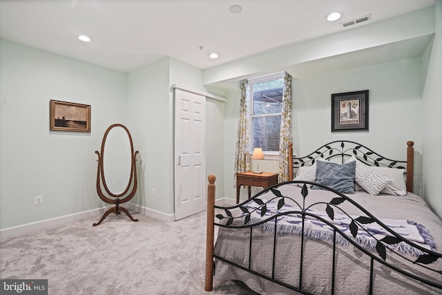 bedroom with baseboards, recessed lighting, visible vents, and carpet floors