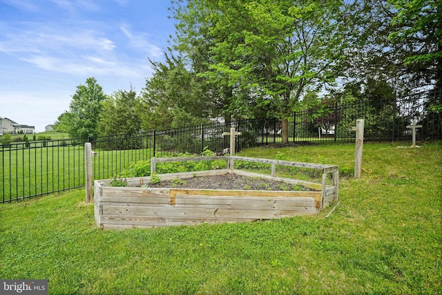 view of yard with a garden and fence