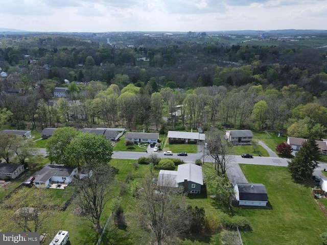 aerial view with a residential view and a wooded view