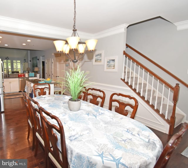 dining area featuring recessed lighting, ornamental molding, an inviting chandelier, dark wood-type flooring, and stairway
