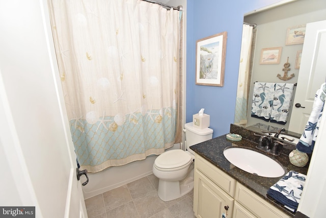 bathroom featuring toilet, tile patterned floors, vanity, and shower / bathtub combination with curtain