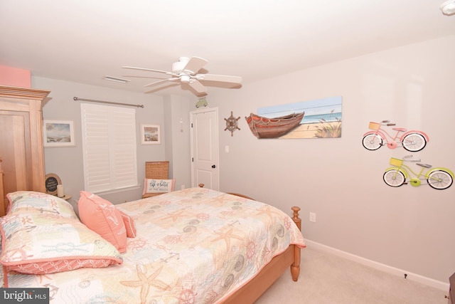 carpeted bedroom featuring baseboards, visible vents, and ceiling fan