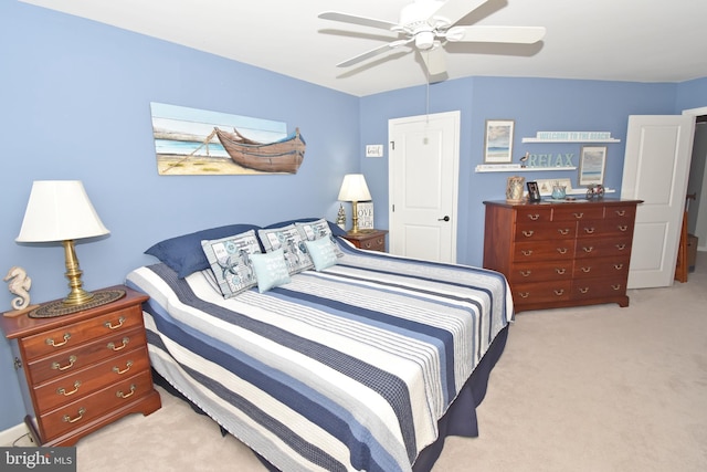 bedroom with light carpet and ceiling fan