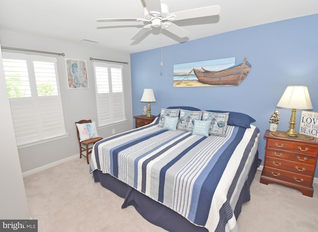 bedroom featuring carpet, visible vents, baseboards, and a ceiling fan