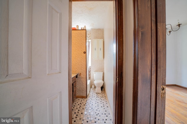 full bathroom featuring toilet and vanity