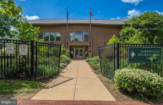 view of property's community featuring a gate and fence