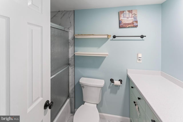 full bathroom with toilet, baseboards, enclosed tub / shower combo, and vanity