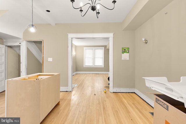 1222 18th St NE, Washington, DC 20002 - interior space with baseboards, light wood finished floors, and an inviting chandelier