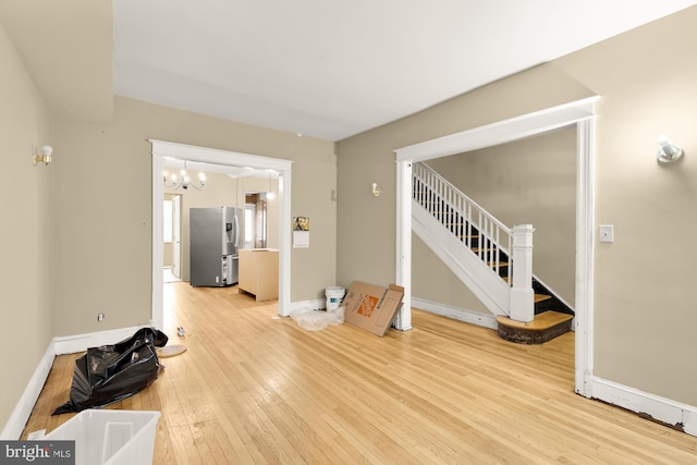 1222 18th St NE, Washington, DC 20002 - interior space featuring stairway, a notable chandelier, baseboards, and light wood finished floors