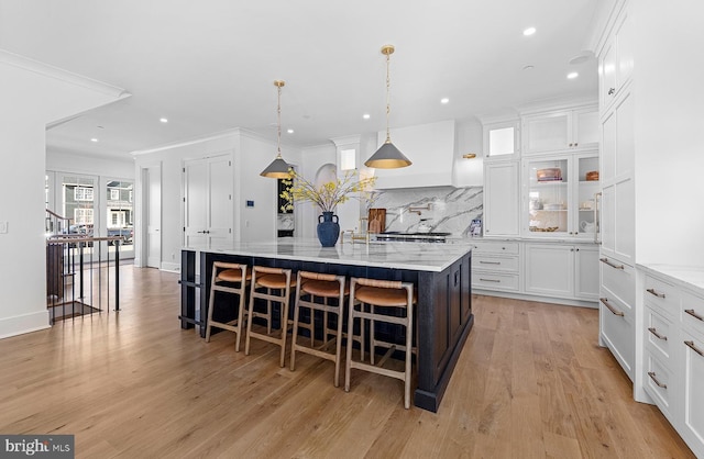 76 Filly Ln, Lewes, DE 19958 - kitchen featuring a large island, backsplash, white cabinets, a breakfast bar, and recessed lighting