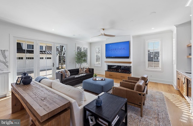 76 Filly Ln, Lewes, DE 19958 - living area with ornamental molding, light wood-type flooring, french doors, baseboards, and recessed lighting