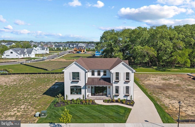 76 Filly Ln, Lewes, DE 19958 - view of front of home with a standing seam roof and metal roof