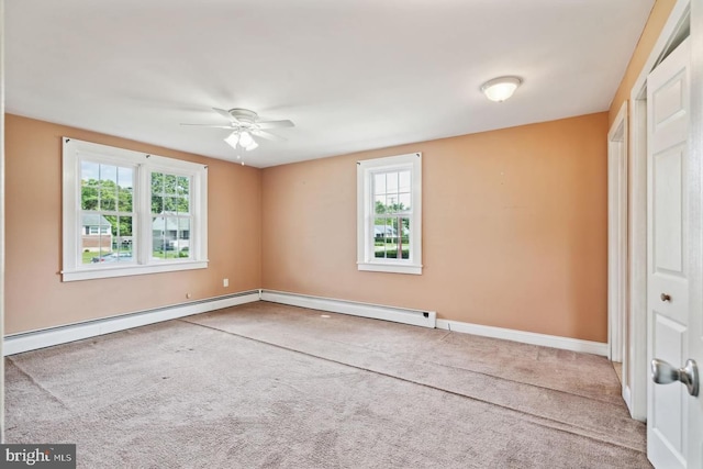 unfurnished bedroom featuring carpet floors, multiple windows, and a baseboard radiator