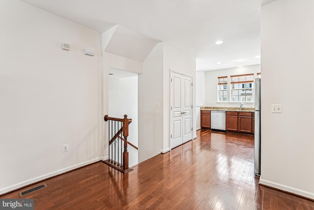 8210 Heritage Crossing Ct, Manassas, VA 20109 - corridor featuring an upstairs landing, hardwood / wood-style floors, recessed lighting, baseboards, and a sink
