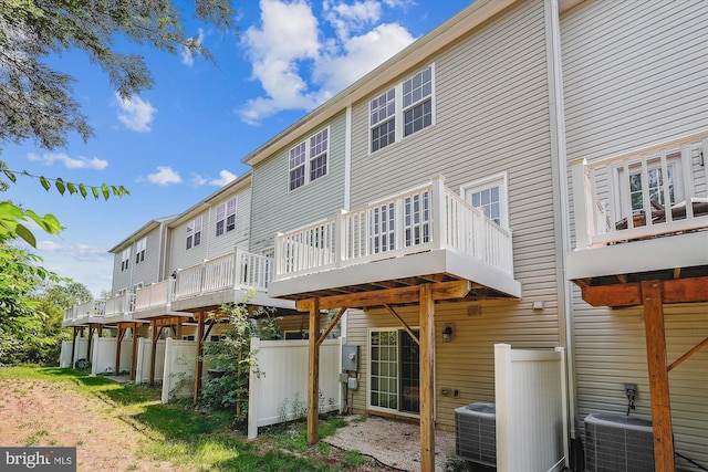 8210 Heritage Crossing Ct, Manassas, VA 20109 - rear view of property with central AC unit and a wooden deck