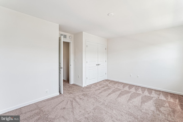 8210 Heritage Crossing Ct, Manassas, VA 20109 - unfurnished bedroom featuring carpet floors, baseboards, and a closet