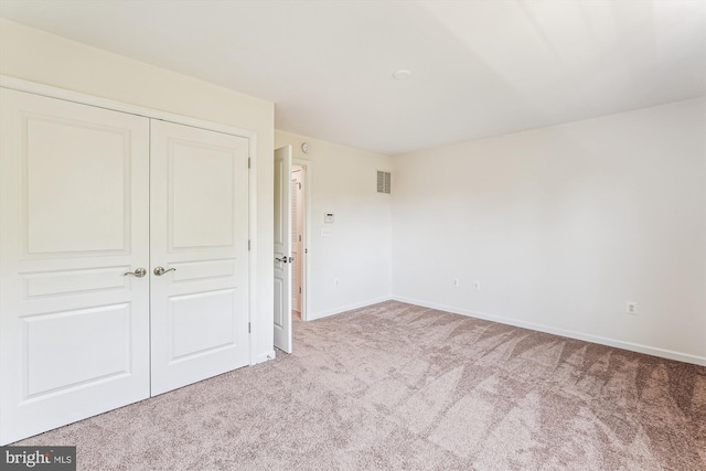 8210 Heritage Crossing Ct, Manassas, VA 20109 - unfurnished bedroom with carpet flooring, a closet, and baseboards