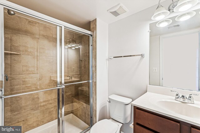 8210 Heritage Crossing Ct, Manassas, VA 20109 - bathroom with toilet, vanity, and a shower stall