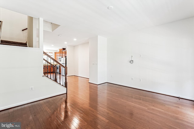 8210 Heritage Crossing Ct, Manassas, VA 20109 - unfurnished room featuring stairway, hardwood / wood-style flooring, baseboards, and recessed lighting