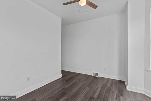 unfurnished room featuring a ceiling fan, baseboards, visible vents, and dark wood-type flooring