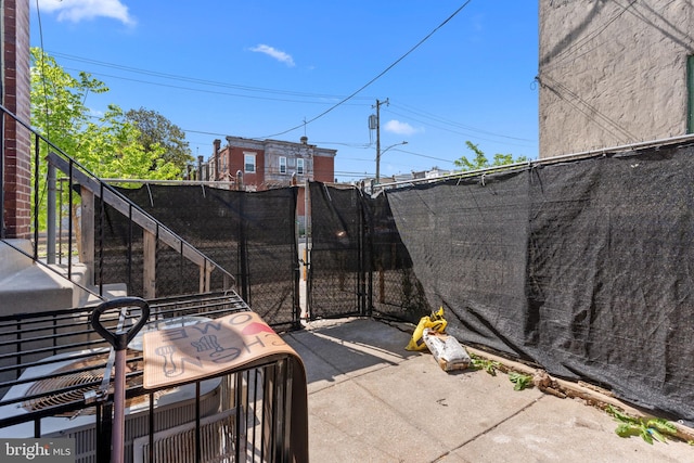 exterior space featuring fence and stairs