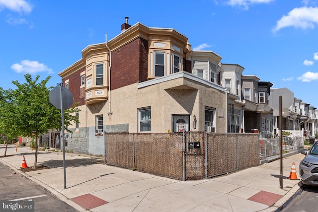 exterior space featuring a residential view and fence private yard
