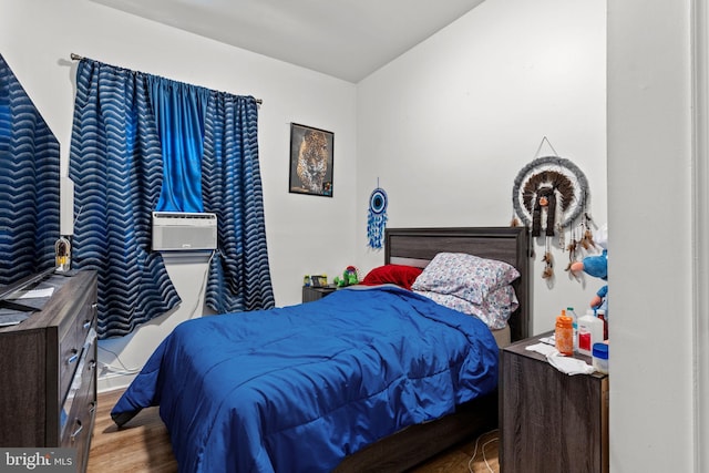 bedroom with wood finished floors