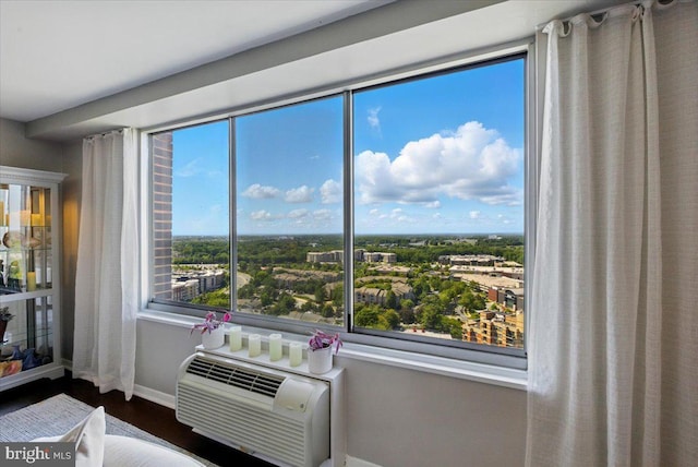 9701 Fields Rd Unit 2301, Gaithersburg, MD 20878 - detailed view of wood finished floors, baseboards, and a wall unit AC