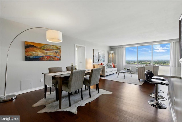 9701 Fields Rd Unit 2301, Gaithersburg, MD 20878 - dining room with dark wood-type flooring and baseboards