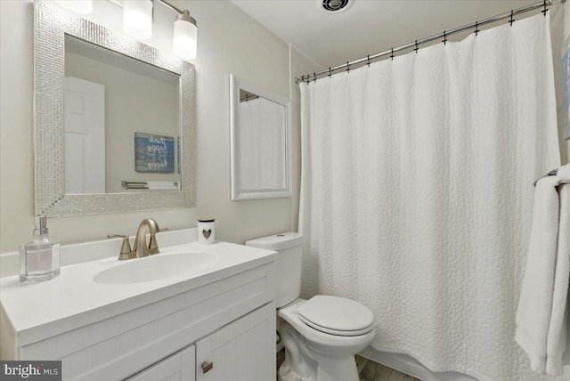 9701 Fields Rd Unit 2301, Gaithersburg, MD 20878 - bathroom with toilet, vanity, and a shower with shower curtain