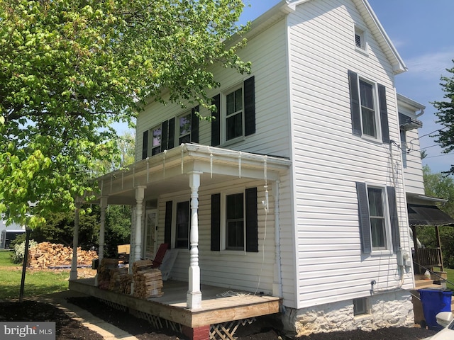 view of property exterior featuring a porch