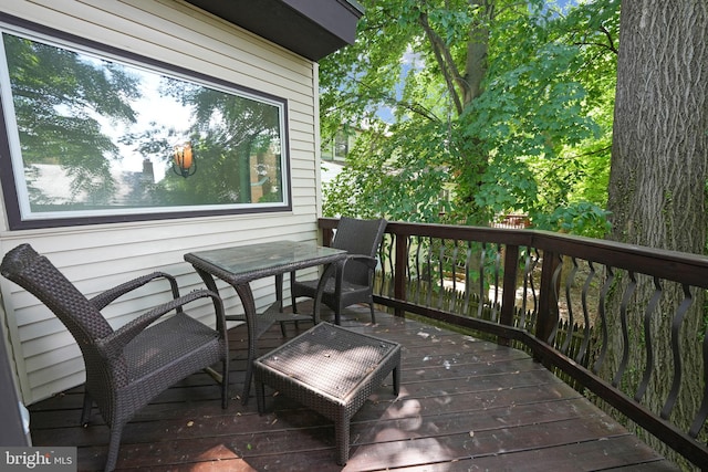 wooden deck with outdoor dining area