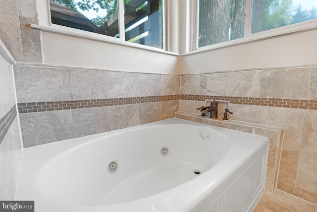 full bath with a jetted tub