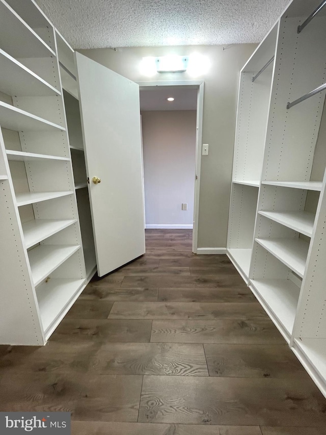 200 N Pickett St Unit 1412, Alexandria, VA 22304 - spacious closet with dark wood-type flooring