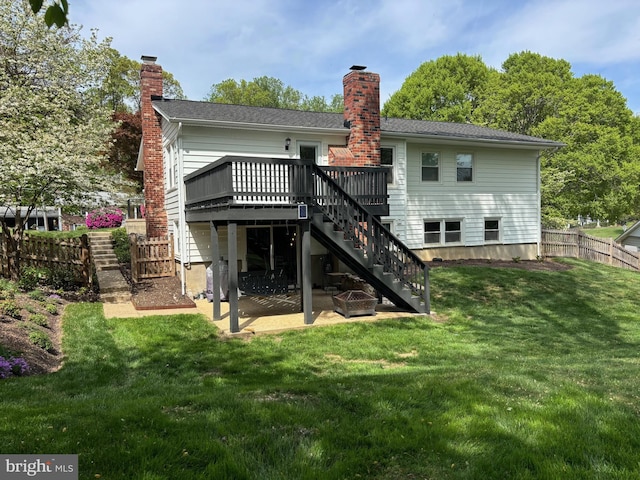 back of house with a chimney, stairs, a deck, and a patio