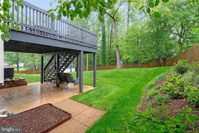 view of yard featuring a patio, stairs, central AC unit, and a wooden deck