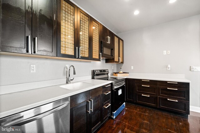 3700 13th St NW, Washington, DC 20010 - kitchen with stainless steel appliances, dark wood-style flooring, recessed lighting, and light countertops