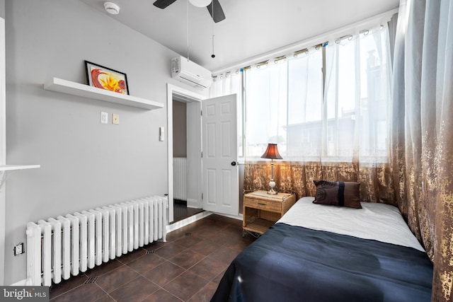 3700 13th St NW, Washington, DC 20010 - bedroom with radiator, a wall mounted air conditioner, a ceiling fan, and dark tile patterned floors