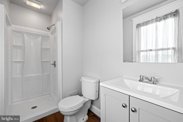 3700 13th St NW, Washington, DC 20010 - bathroom with a shower stall, vanity, and wood finished floors