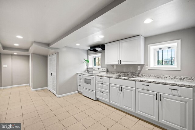 3700 13th St NW, Washington, DC 20010 - kitchen with electric stove, recessed lighting, white cabinetry, and light stone counters