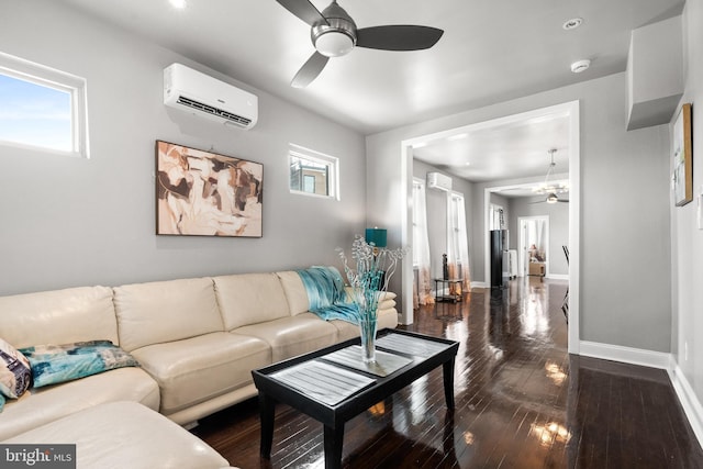 3700 13th St NW, Washington, DC 20010 - living room with an AC wall unit, ceiling fan, and dark wood-type flooring