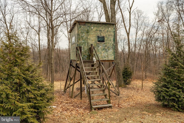 view of outbuilding with stairway