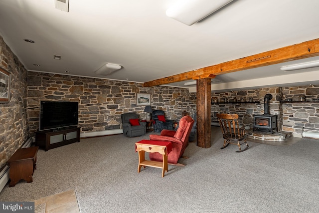 carpeted living area featuring a wood stove