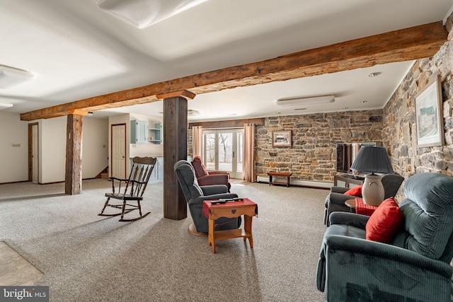 carpeted living room featuring beamed ceiling