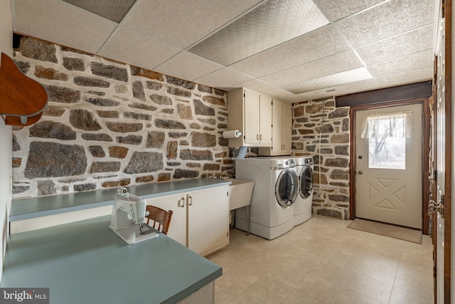 laundry room with cabinet space and washing machine and clothes dryer