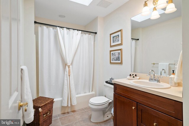 full bath with vanity, toilet, tile patterned floors, shower / bath combination with curtain, and visible vents
