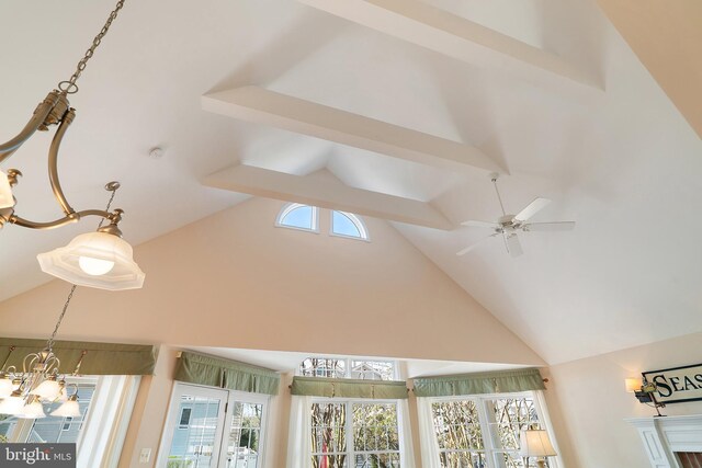 room details featuring ceiling fan with notable chandelier