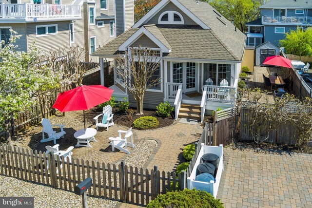 back of house featuring a patio, roof with shingles, and fence private yard