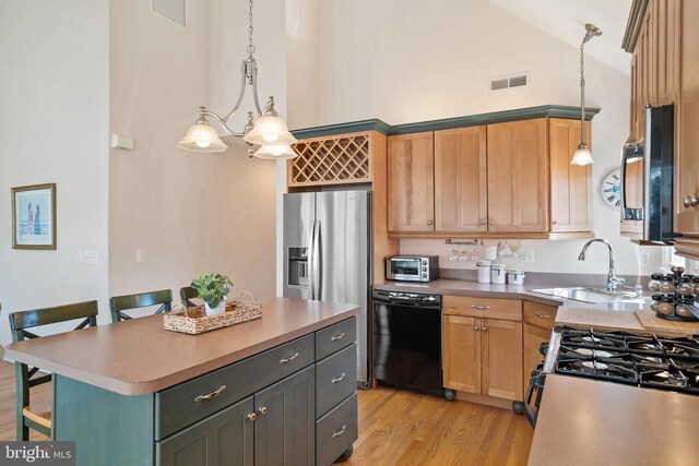 kitchen with visible vents, a breakfast bar, dishwasher, and high vaulted ceiling